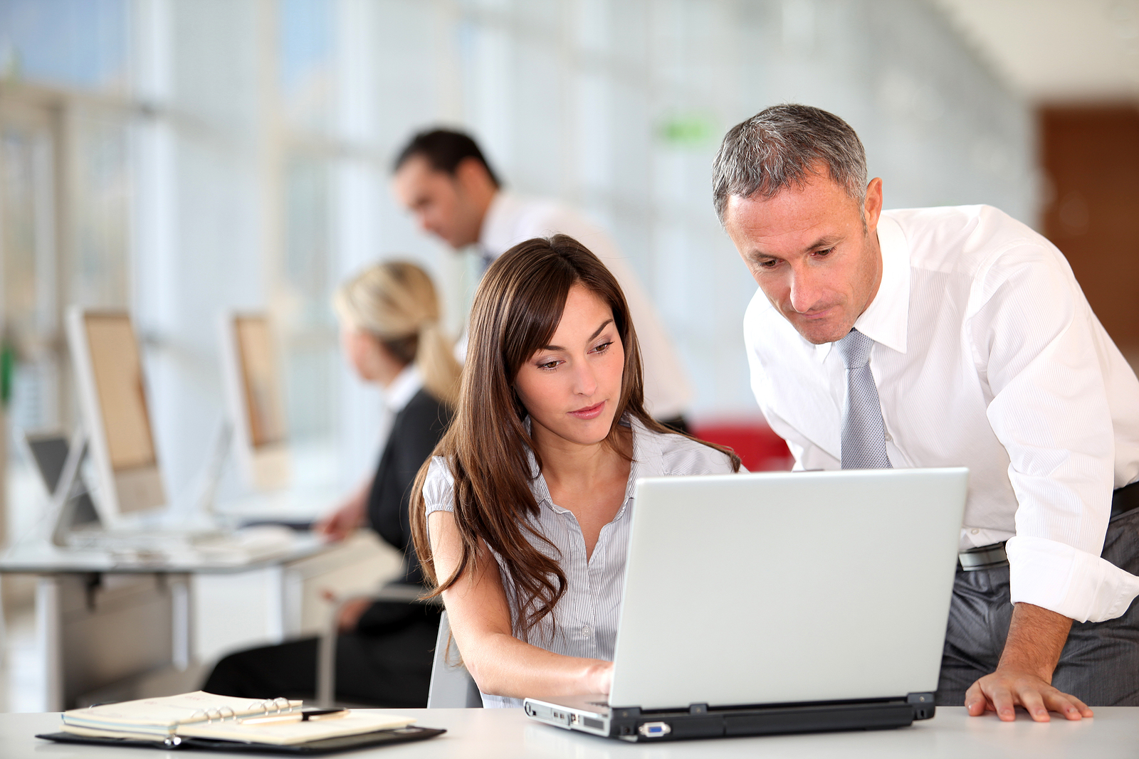 Manager and secretary working in the office